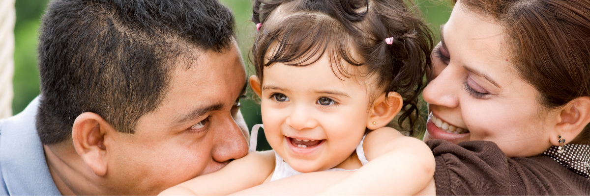 Dad and mom with a beautiful child